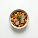 Schweinerücken geschmort, mit Gemüse und Sauce