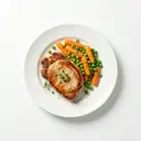 Schweinesteak gebraten, mit Karotten und Erbsen gedünstet