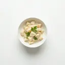 Wurzelpetersilie gedünstet, in Grundsauce hell/weiß mit Sahne