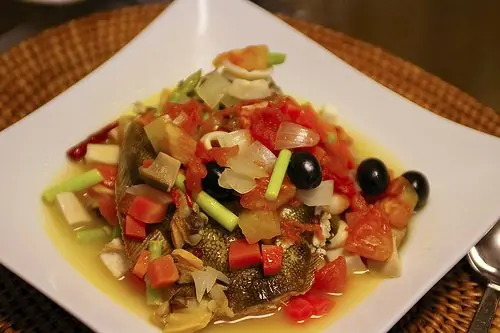 Foto von Pesce all'Acqua Pazza (Fisch in verrücktem Wasser) – fertig angerichtet